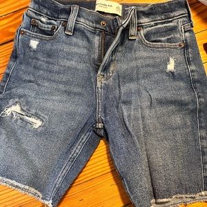 Our new at-the-knee length denim shorts, featuring a blue wash,